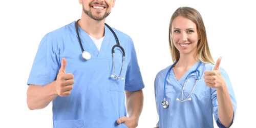 Male And Female Nurses Showing Thumb Up On White Background