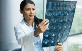 Closeup,Portrait,Of,Intellectual,Woman,Healthcare,Personnel,With,White,Labcoat,