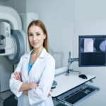 Experienced,Female,Radiologist,Standing,Near,Mammography,Workstation,At,Radiology,Room