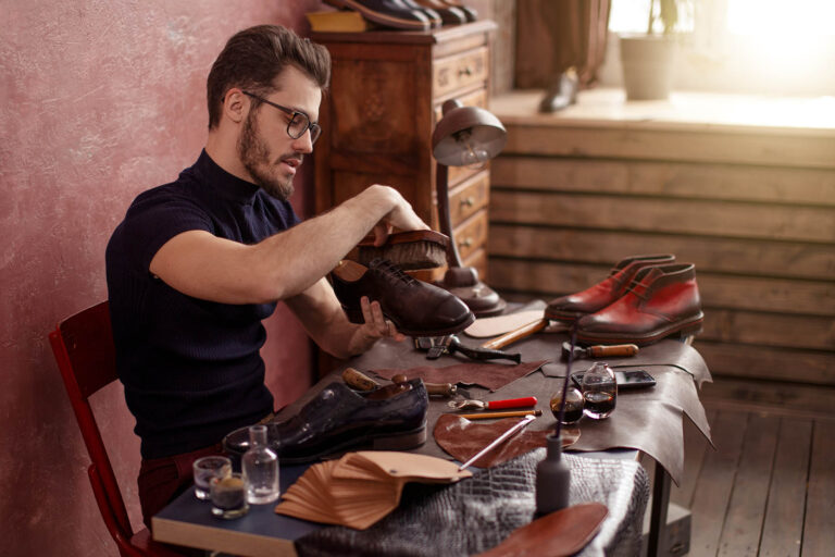 Handsome,Guy,Using,A,Shoe,Brush.,Side,View,Photo