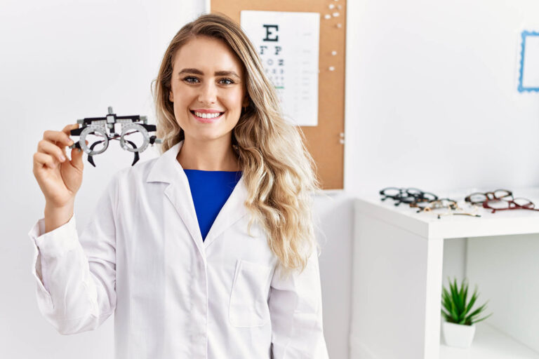 Young,Beautiful,Optician,Woman,Holding,Optometry,Glasses,Looking,Positive,And