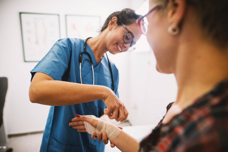 Professional,Nurse,At,The,Hospital,Bandaging,The,Hand,With,A