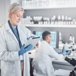 Senior,Scientist,Woman,,Tablet,And,Laboratory,For,Analysis,,Research,Or