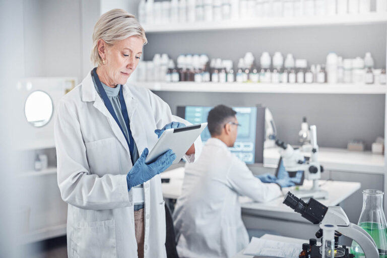 Senior,Scientist,Woman,,Tablet,And,Laboratory,For,Analysis,,Research,Or