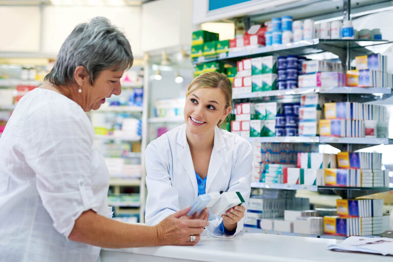 Pharmacist,Explaining,Medicine,To,A,Woman,In,The,Pharmacy,For