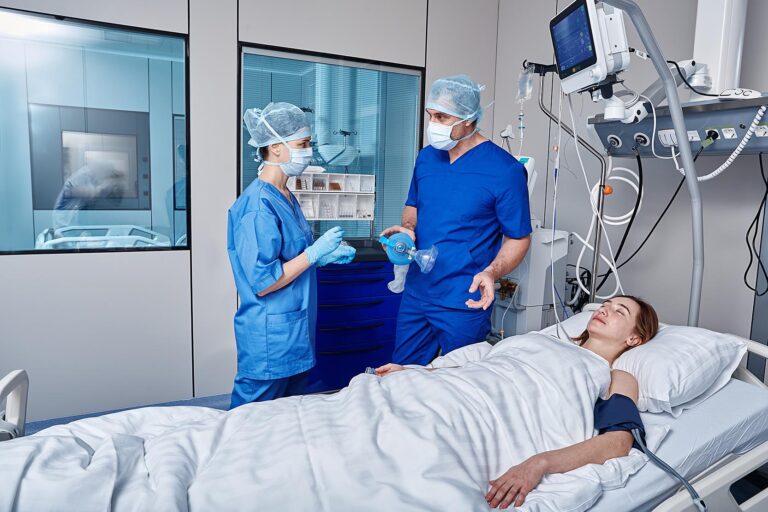 Female,Unconscious,Patient,Attached,To,Medical,Monitoring,Equipment,In,Intensive