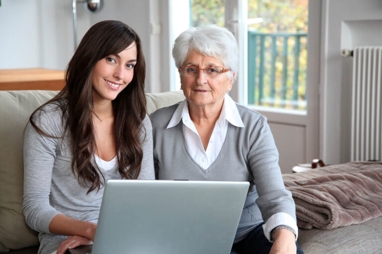 Young,Woman,And,Elderly,Woman,With,Laptop,Computer